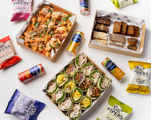 Assorted food items including wraps, snacks, and drinks on a white background with 'Pipers' branding.
