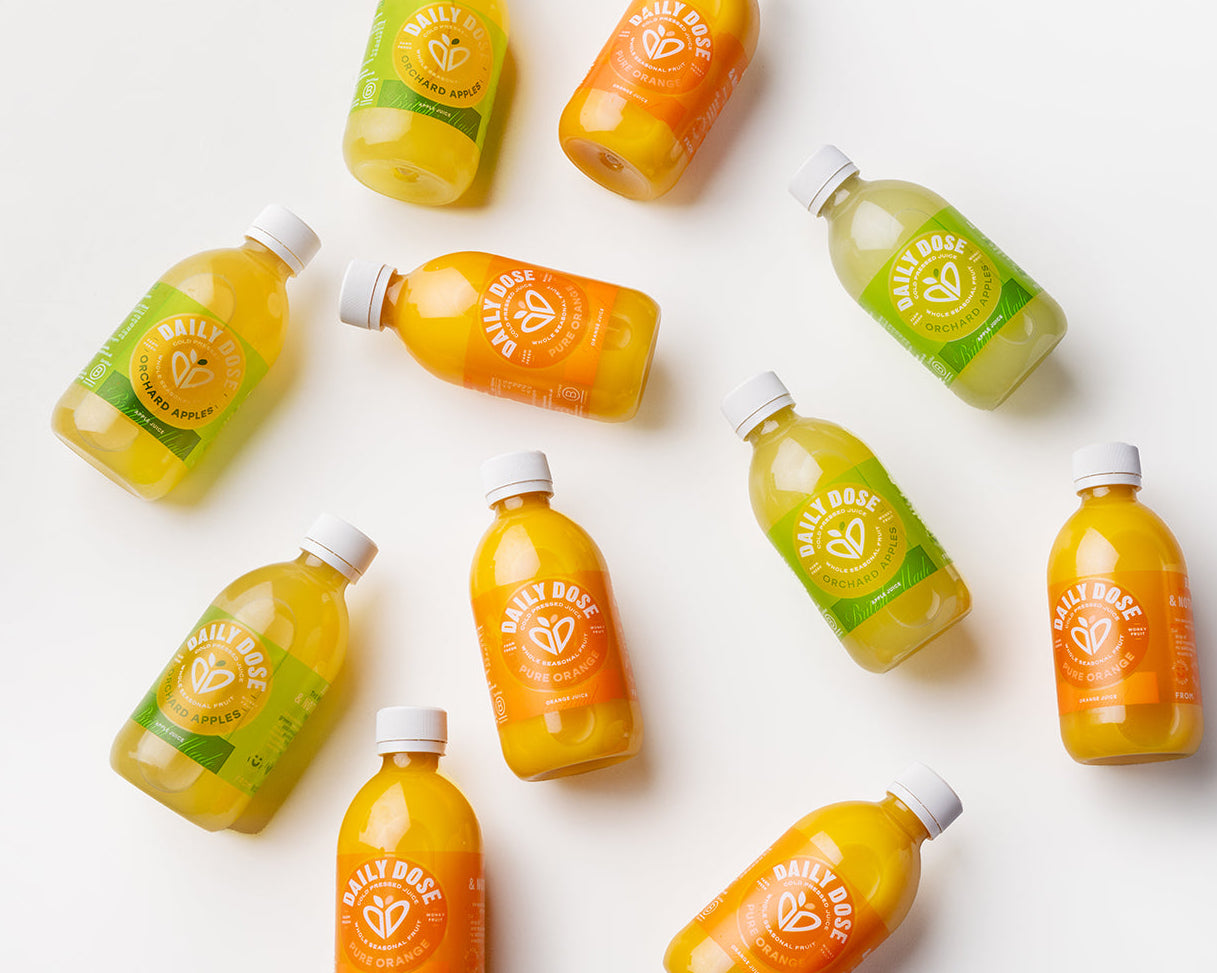 Assorted bottles of juice on a white background