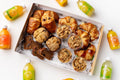 Assorted pastries and drinks on a white surface