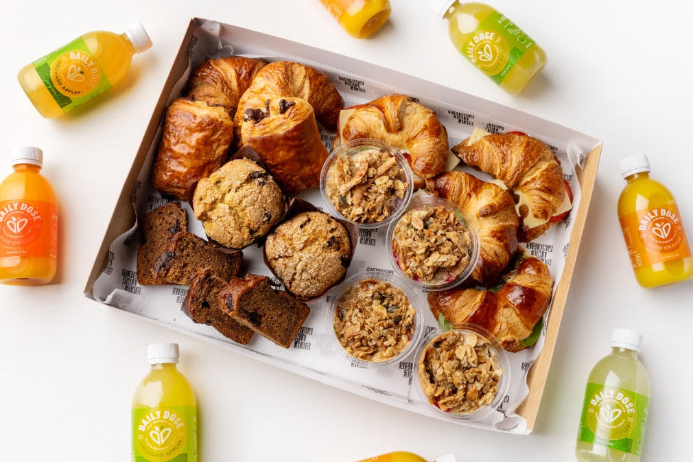 Assorted pastries and drinks on a white surface
