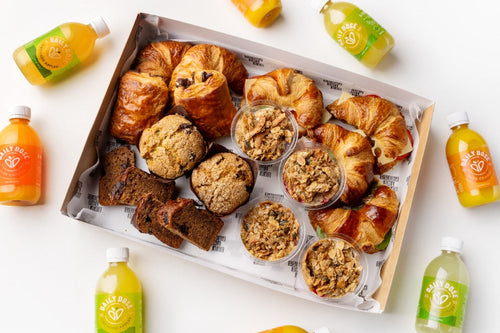 Assorted pastries and drinks on a white surface
