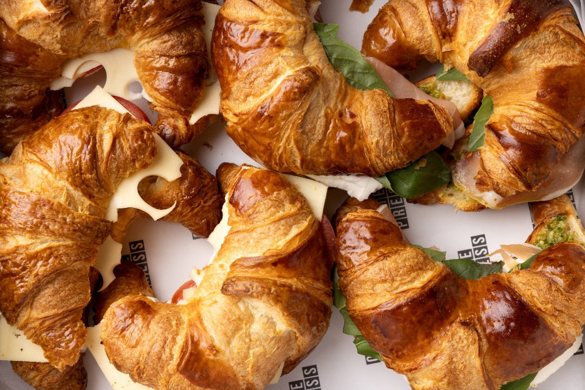 Croissants with fillings on a white surface