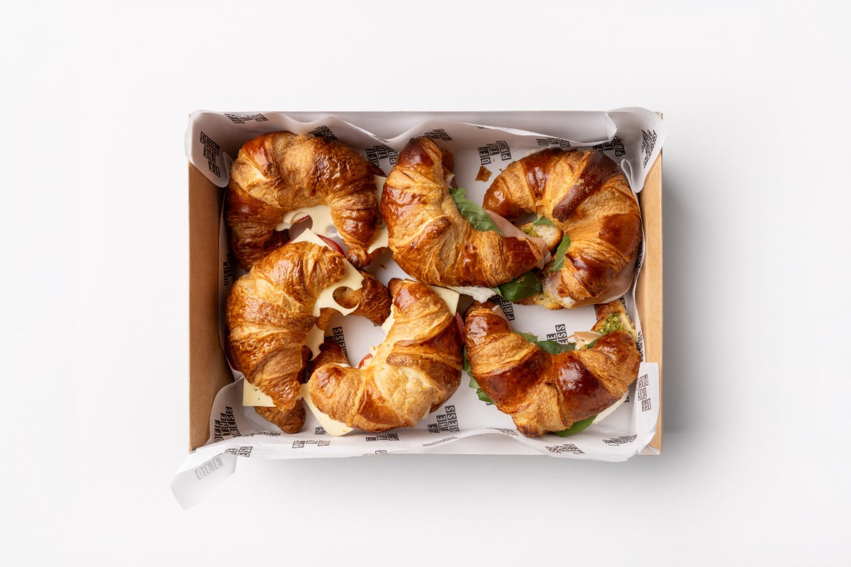 Box of croissants on a white background