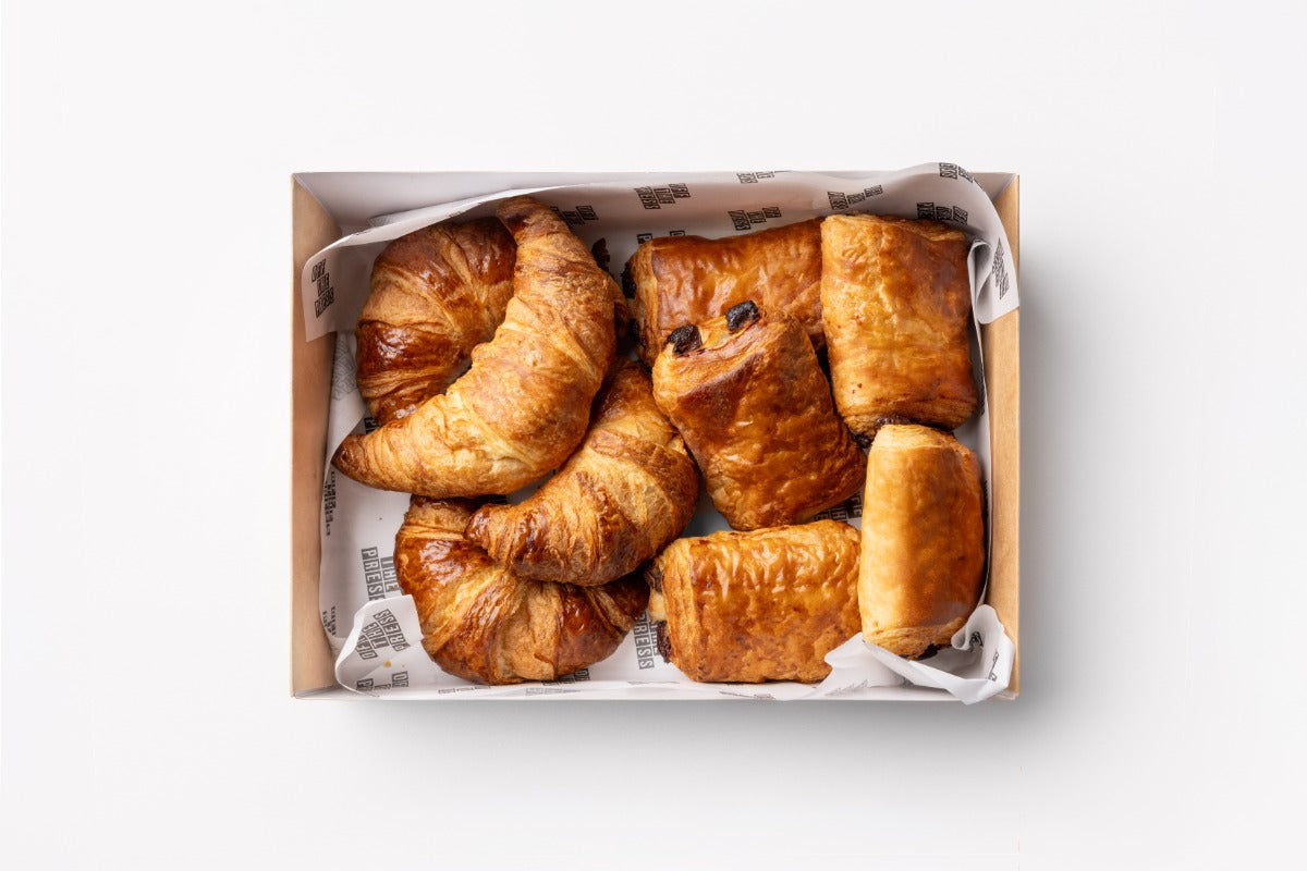 Box of croissants on a white background