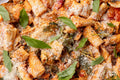Close-up of a pasta dish with vegetables and herbs