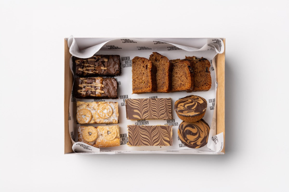 Box of assorted cookies on a white background