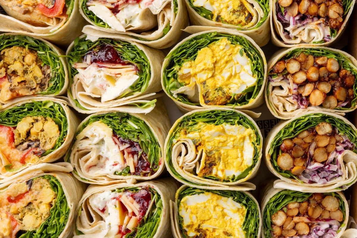 Grid of various wraps with different fillings on a neutral background
